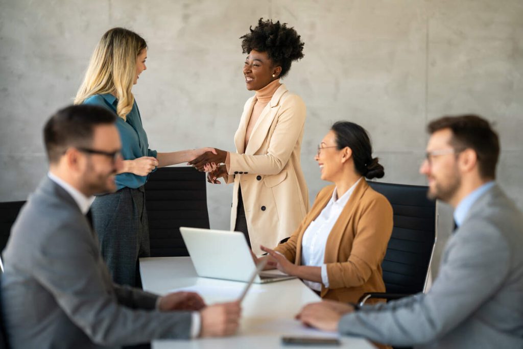 Success diverse group of multiethnic entrepreneurs and business people achieving goals in corporate office